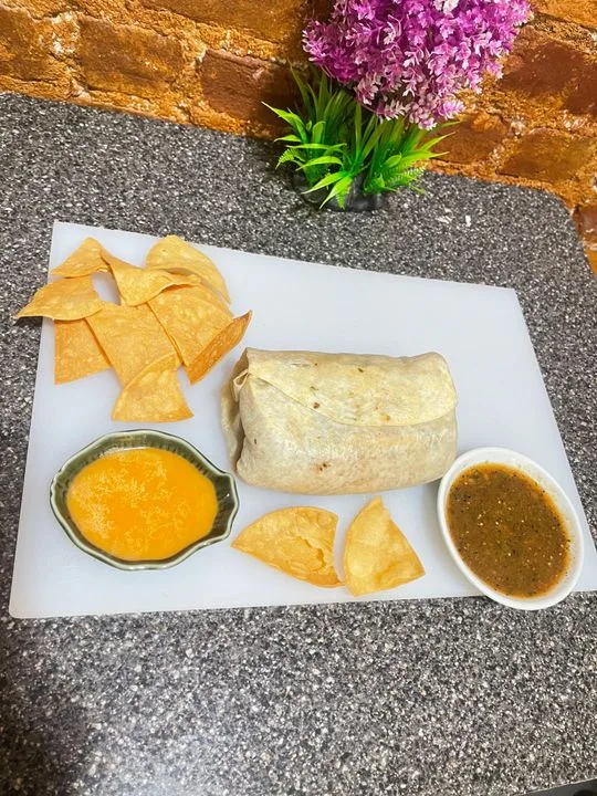Loaded burrito with chips and fresh salsas