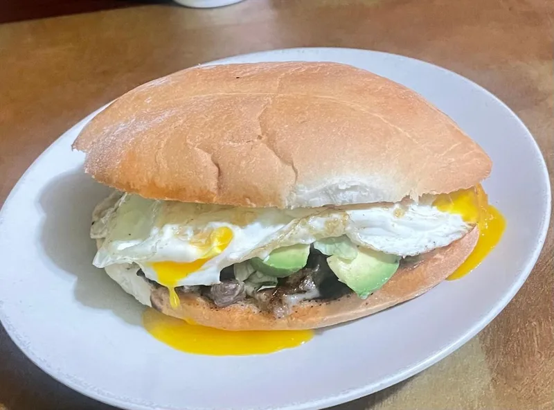 Torta with fried egg and fresh avocado